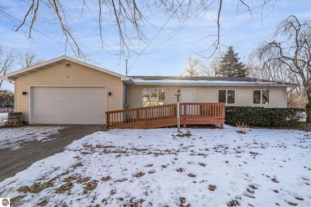 ranch-style home with a garage and a deck