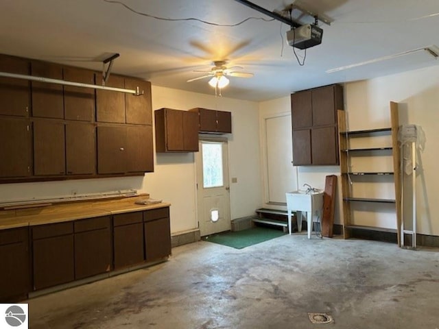 garage featuring a garage door opener and a sink