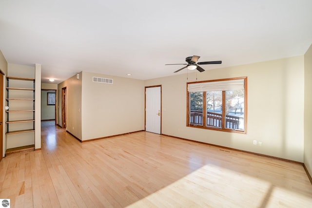 unfurnished living room with ceiling fan and light wood-type flooring