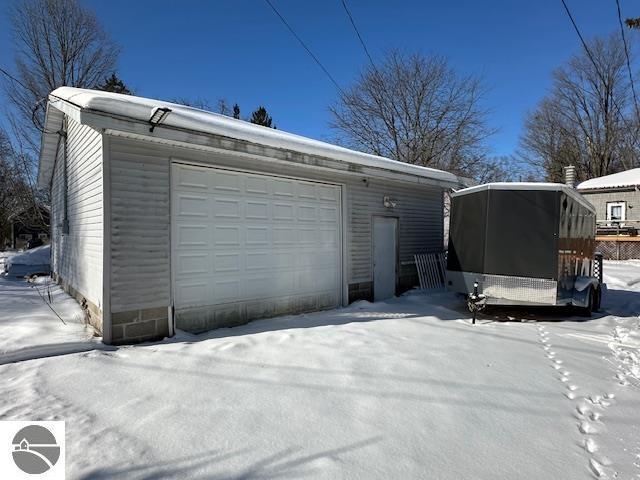 view of snow covered garage