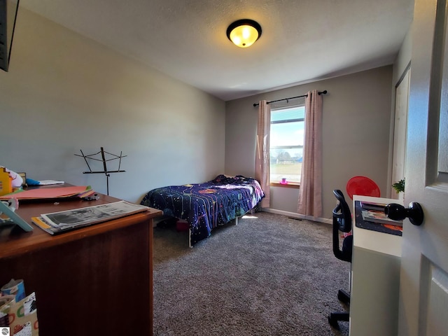 bedroom featuring dark carpet