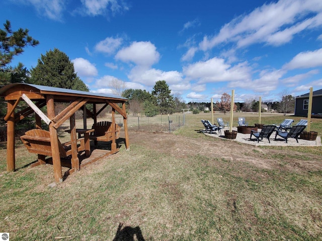 view of yard with a gazebo and a fire pit