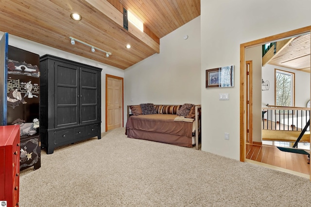 sitting room featuring beam ceiling, high vaulted ceiling, carpet floors, and wood ceiling