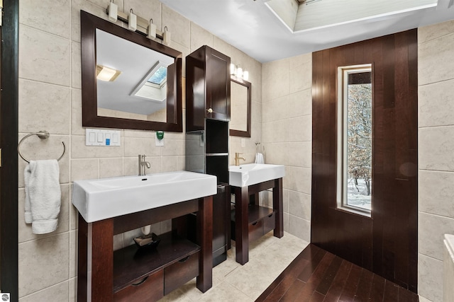 bathroom with vanity, tile walls, and tile patterned floors