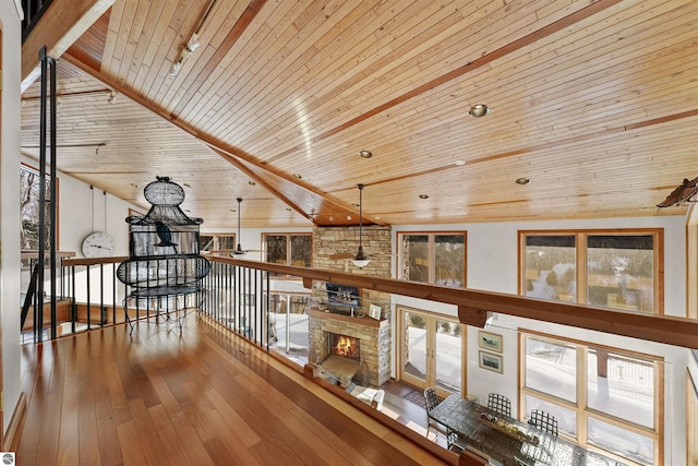 hallway with wood-type flooring and wooden ceiling