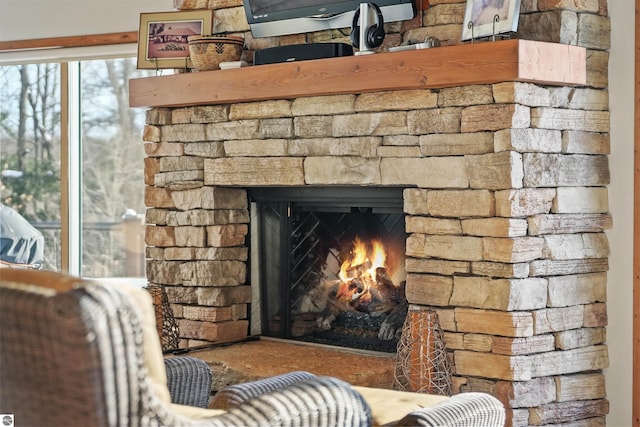 room details featuring a stone fireplace