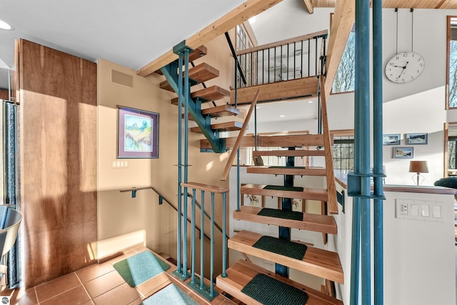 staircase featuring tile patterned floors