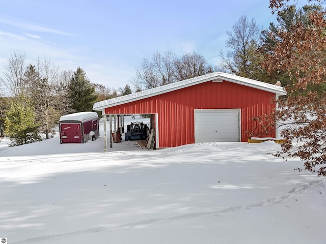 view of snow covered garage