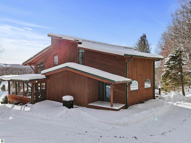 view of snow covered house