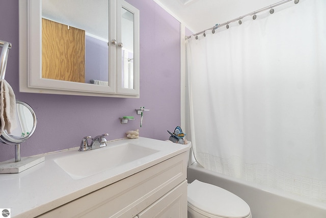 full bathroom featuring vanity, toilet, and shower / tub combo with curtain