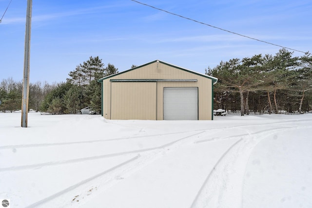 view of snow covered garage