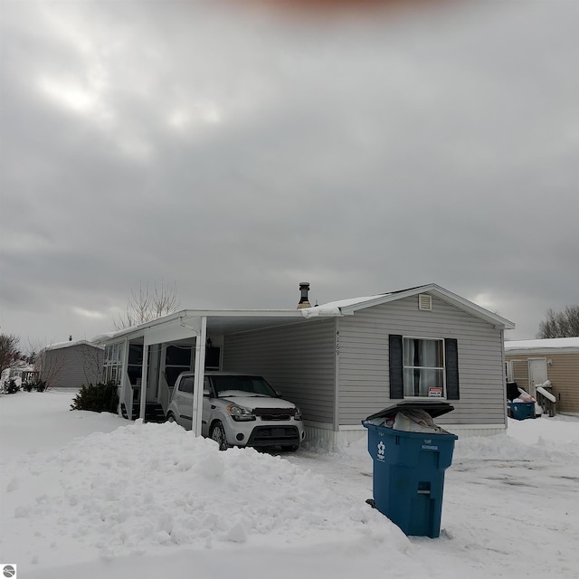 view of snow covered property