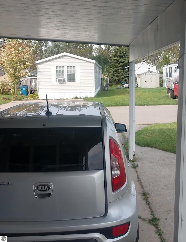 exterior space featuring cooling unit and a carport