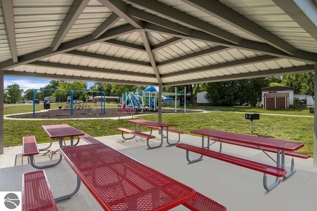 surrounding community featuring a yard, a playground, and a storage unit