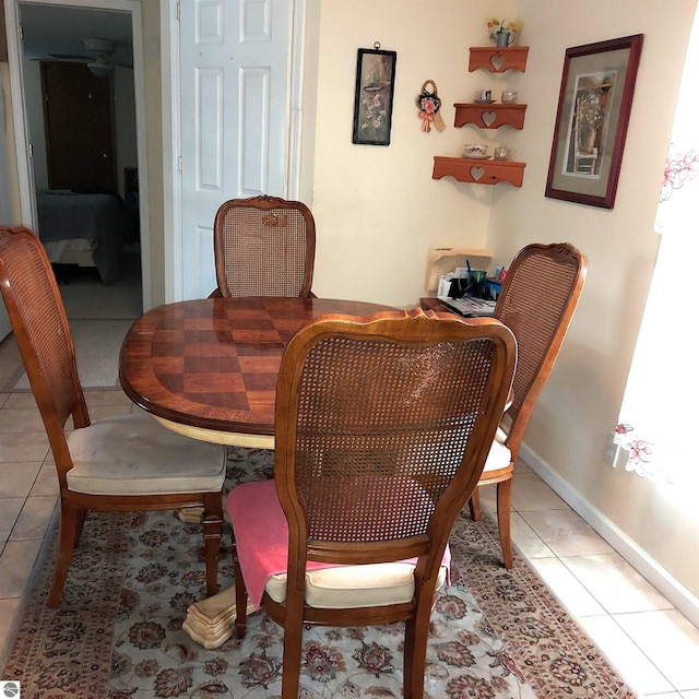 dining space with light tile patterned floors