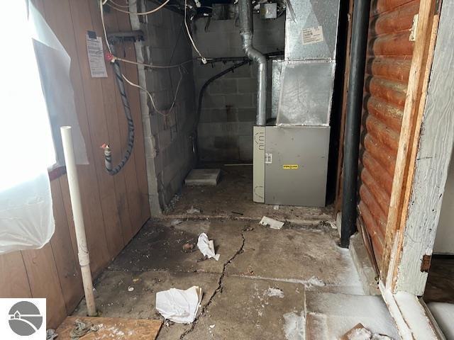 utility room with heating unit