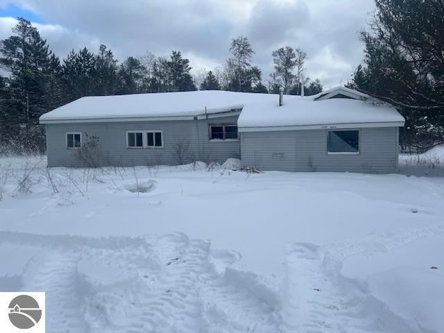 view of snow covered house