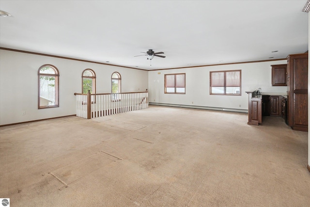 unfurnished living room with ornamental molding, light carpet, and baseboard heating