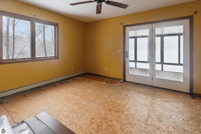 empty room with ceiling fan and baseboard heating