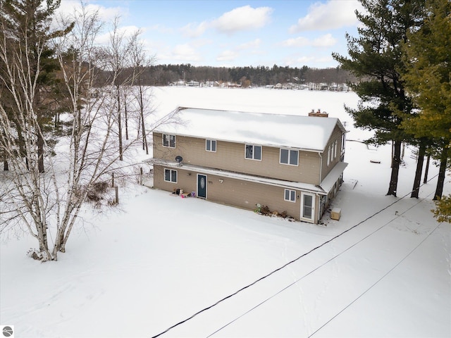 view of snow covered property