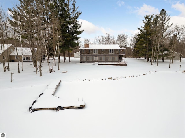 view of yard layered in snow