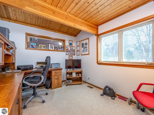 carpeted home office featuring beam ceiling, a wealth of natural light, and wooden ceiling