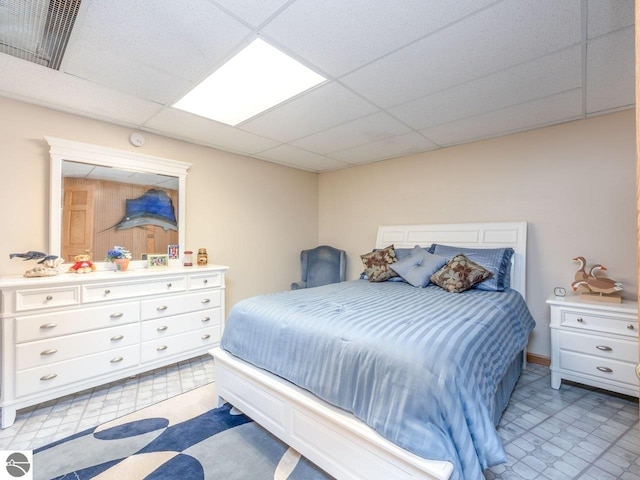 bedroom with a drop ceiling