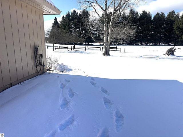 view of yard layered in snow