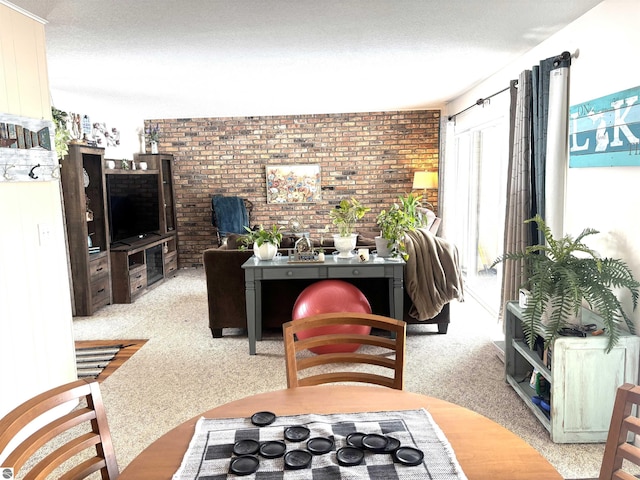 living room with light colored carpet, brick wall, and a textured ceiling