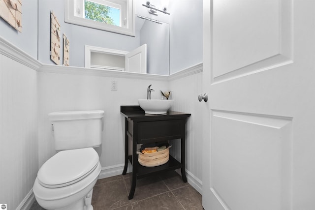 bathroom with vanity, tile patterned floors, and toilet