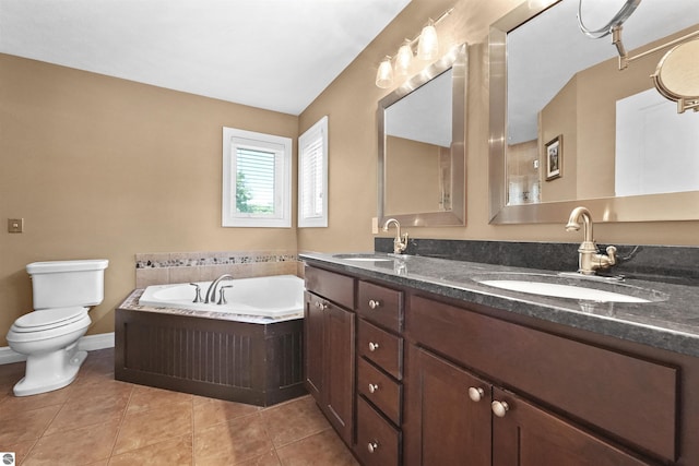 bathroom with a tub to relax in, toilet, tile patterned flooring, and vanity