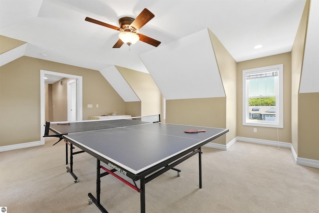 rec room with vaulted ceiling, light colored carpet, and ceiling fan