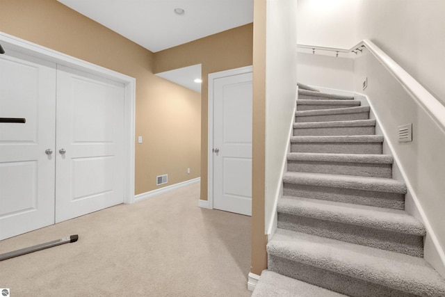 stairs with carpet floors