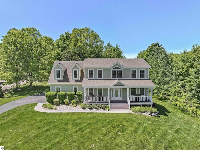 view of front of home featuring a front lawn and a porch