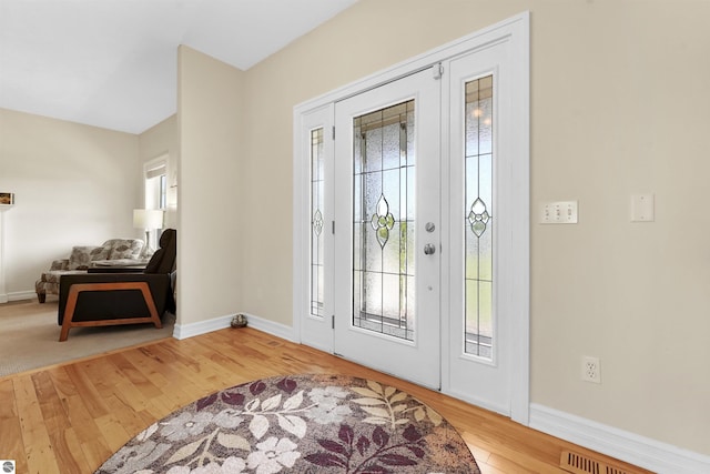 foyer featuring wood-type flooring