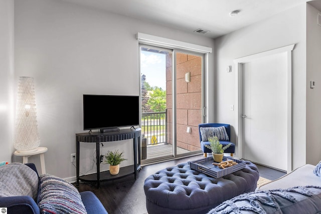 living room with dark hardwood / wood-style floors