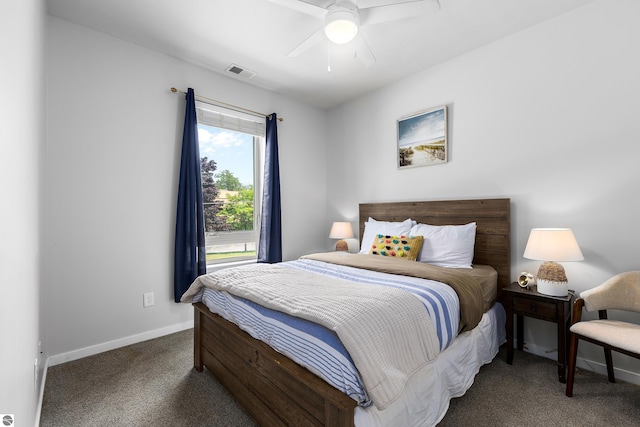 bedroom with dark colored carpet