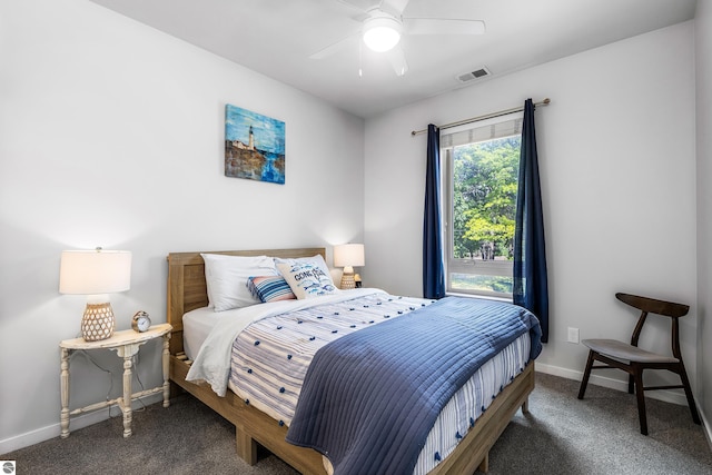 bedroom featuring dark colored carpet and ceiling fan