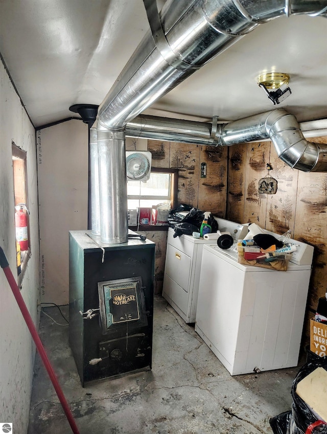 interior space featuring washer and dryer and a wood stove