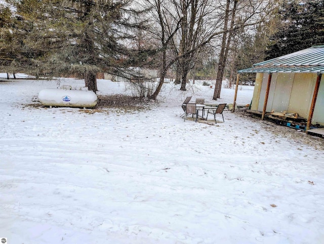 view of yard layered in snow