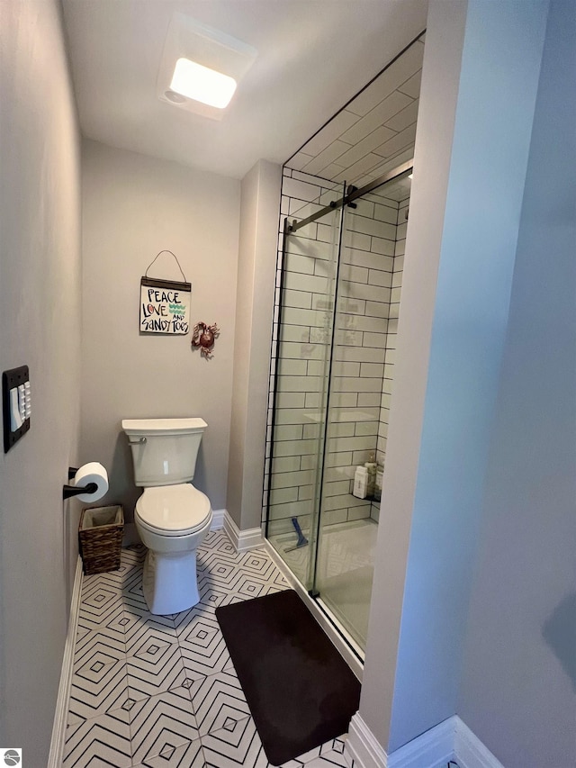 bathroom with toilet and walk in shower