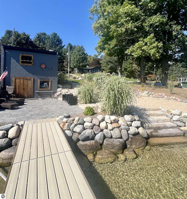 exterior space featuring a fireplace and a patio