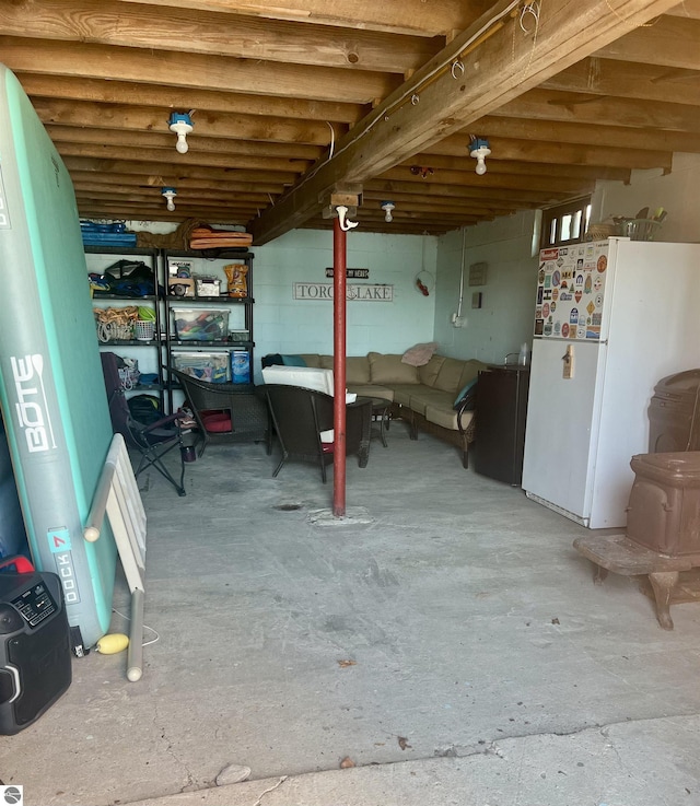 basement with white fridge