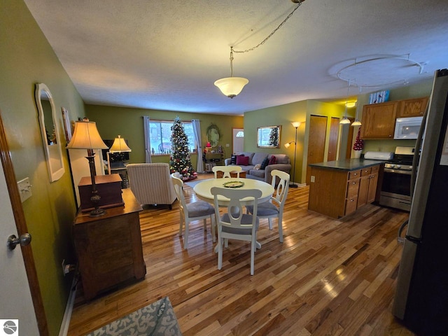 living room with hardwood / wood-style flooring and a textured ceiling