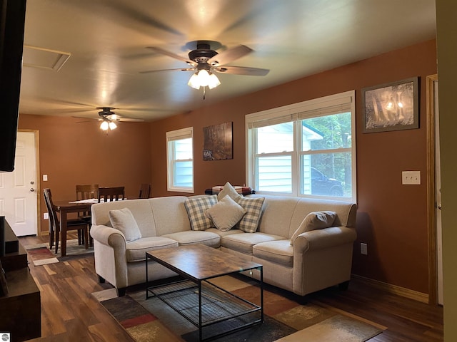 living room with ceiling fan and dark hardwood / wood-style floors