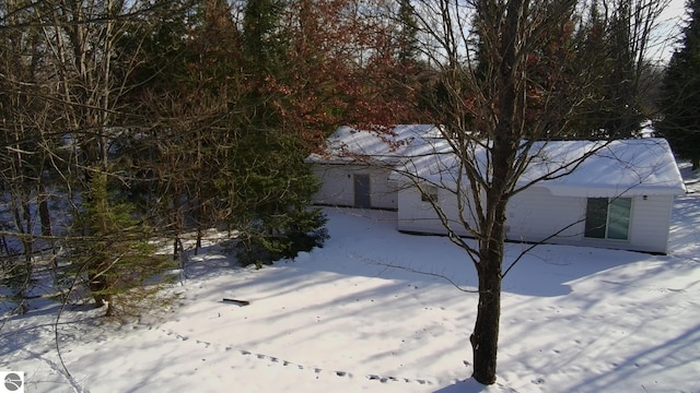 view of snow covered property