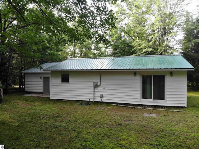 back of house with a yard