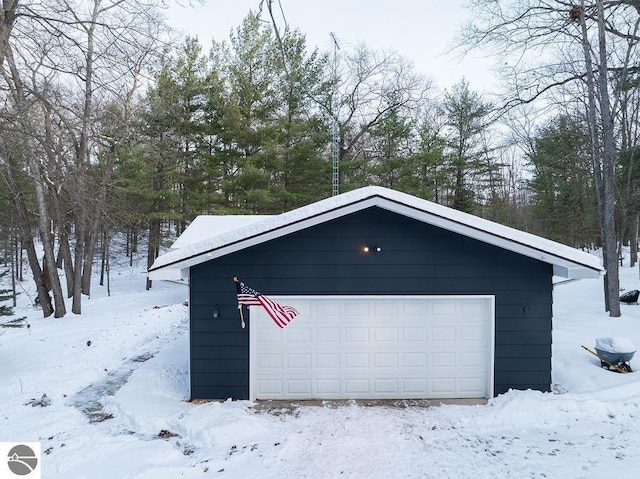 view of snow covered garage