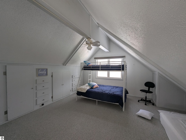 unfurnished bedroom with lofted ceiling, carpet, and a textured ceiling