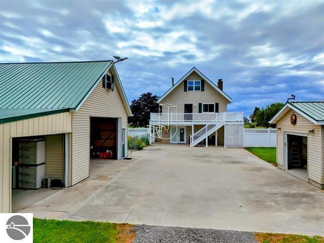 exterior space featuring a garage and an outdoor structure